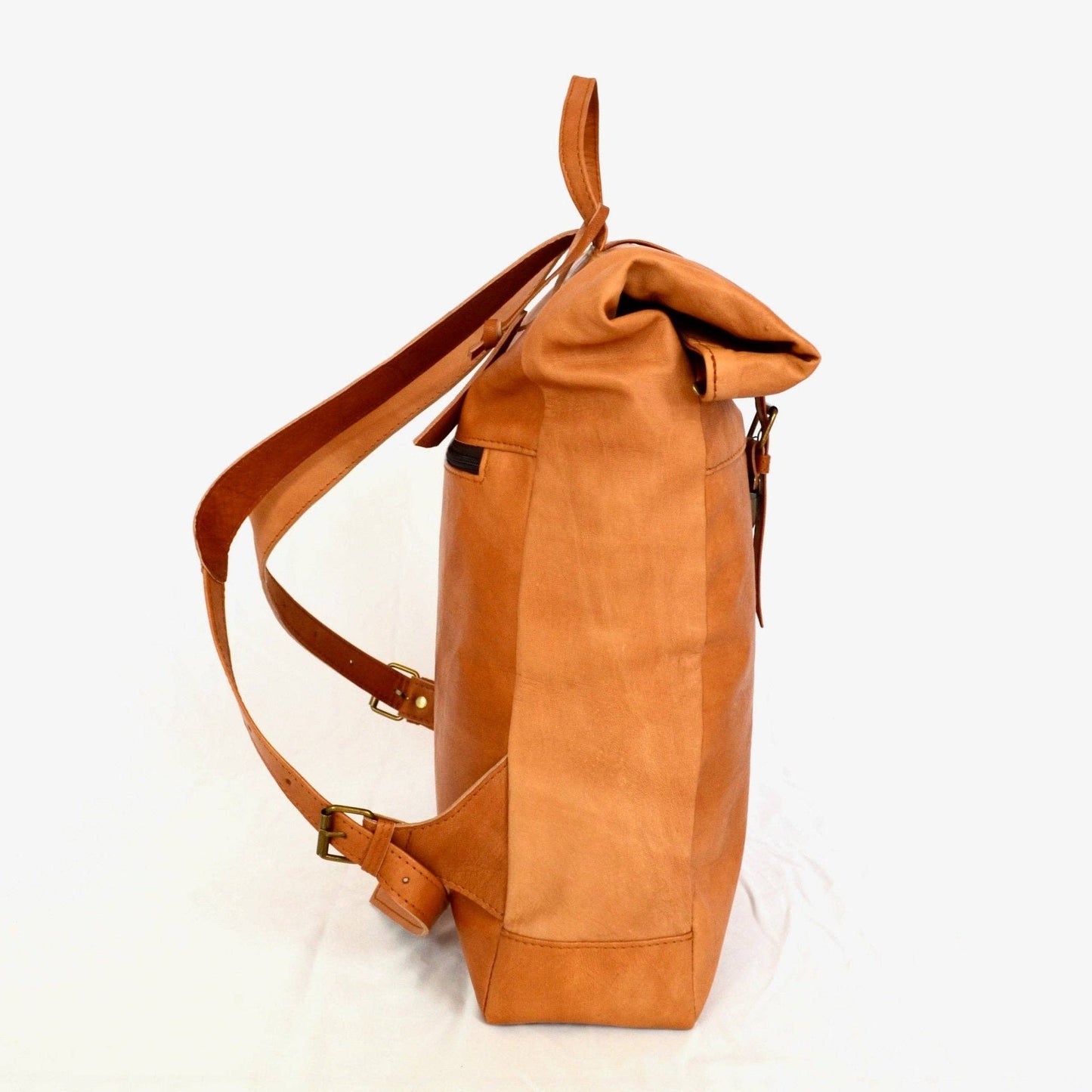 Brown leather backpack on a white background
