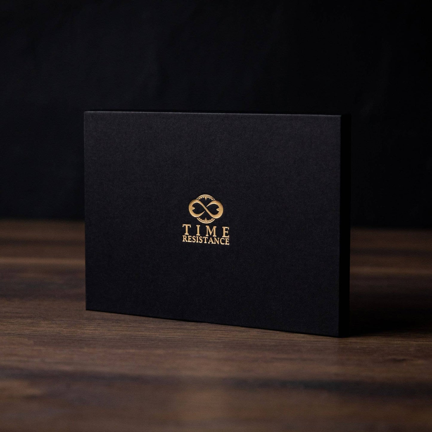 Black box with gold 'Time Resistance' logo on a dark background