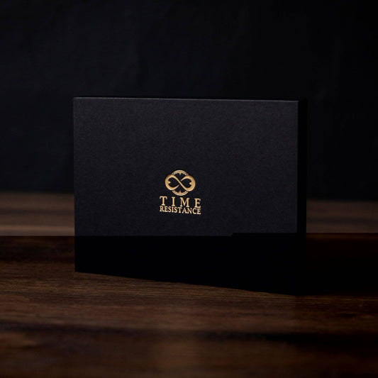 Black card with gold logo and text on a dark background