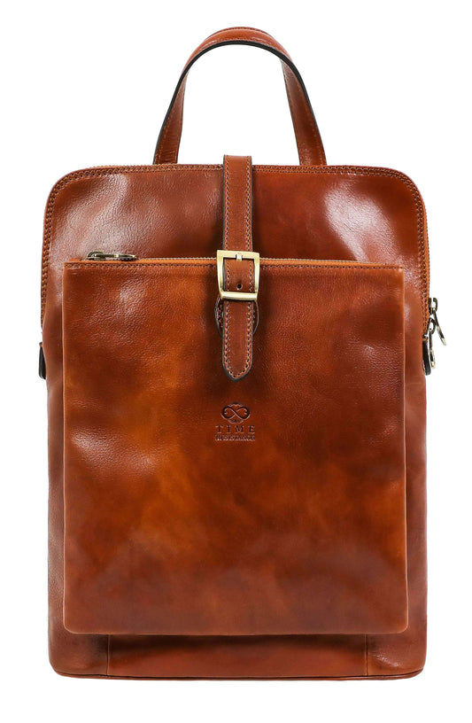 A brown women's leather backpack with a front pocket and metal buckle, designed to be carried on the back or shoulder.