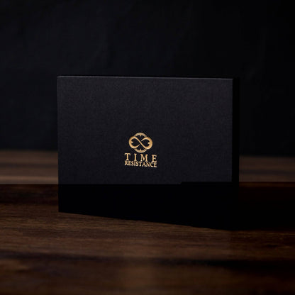 Black card with gold logo and text on a dark background